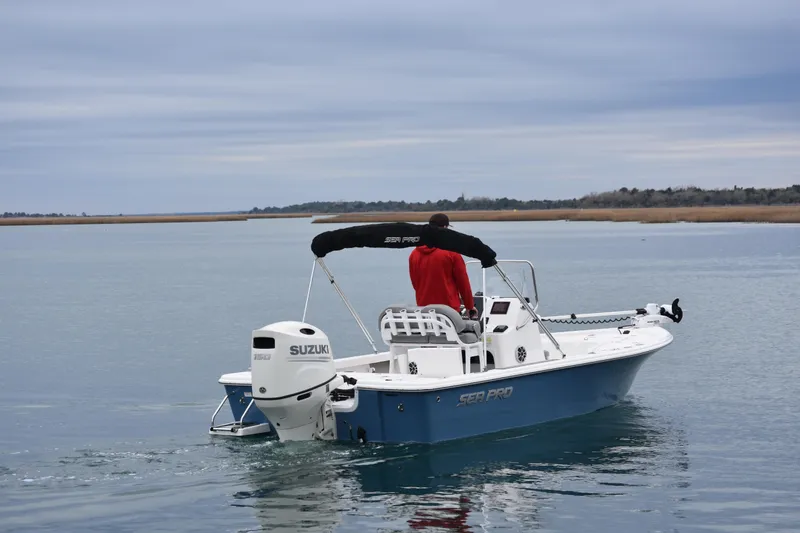 Slide: The Image of 2020 Sea Pro 208 Bay boat on calm water with Suzuki engine. - 6
