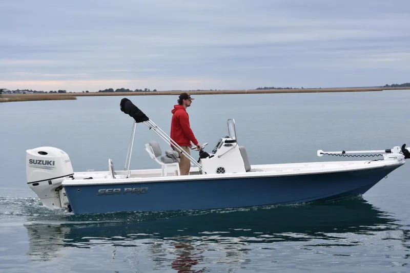 Slide: The Image of 2020 Sea Pro 208 Bay boat cruising on calm water with Suzuki outboard motor. - 7