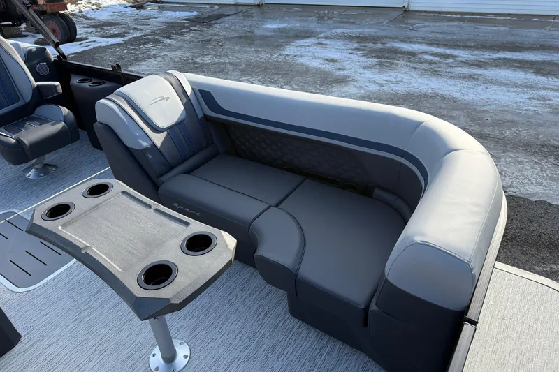 Slide: The Image of 2026 Bennington 22 S Sport Quad Bench with sleek seating and cup holders. - 14