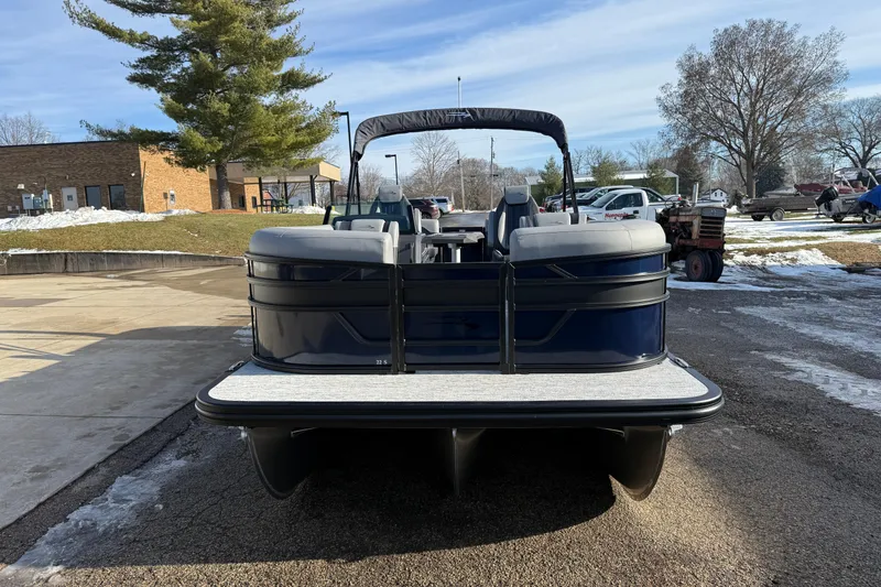 Slide: The Image of 2026 Bennington 22 S Sport Quad Bench pontoon boat on a sunny day. - 2