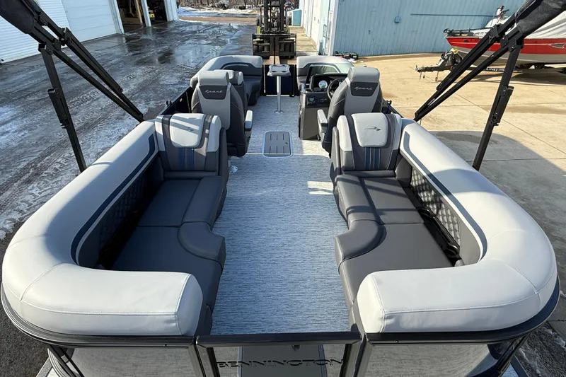 Slide: The Image of 2026 Bennington 22 S Sport Quad Bench pontoon boat with spacious seating and modern design. - 25