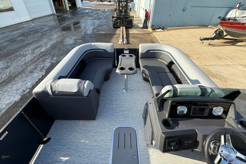 Slide: The Image of 2026 Bennington 22 S Sport Quad Bench boat interior with spacious seating and modern dashboard. - 9