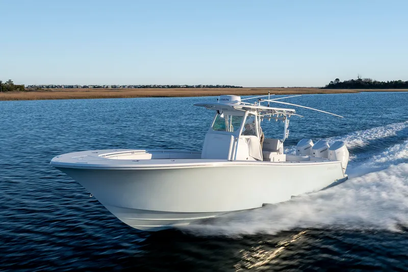 Slide: The Image of 2024 Onslow Bay 33 TE boat cruising on open water. - 10