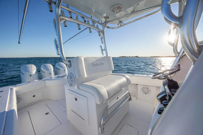 Slide: The Image of 2024 Onslow Bay 33 TE boat interior with ocean view and triple engines. - 27