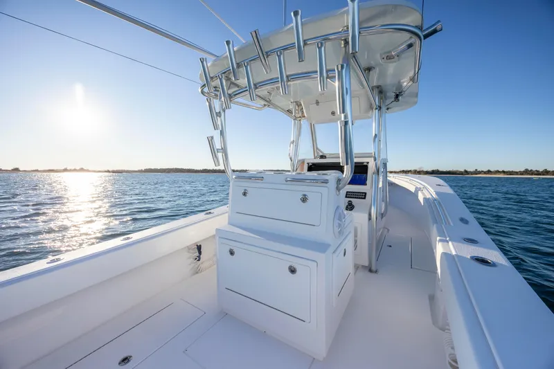 Slide: The Image of 2024 Onslow Bay 33 TE boat on water, featuring sleek design and modern console. - 28