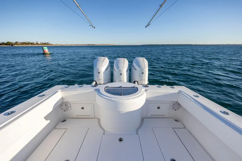 Slide: The Image of 2024 Onslow Bay 33 TE boat with triple engines on open water. - 36