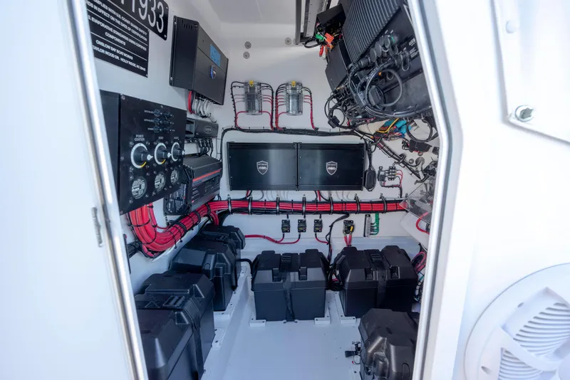 Slide: The Image of 2024 Onslow Bay 33 TE boat electrical system with organized wiring and battery setup. - 42