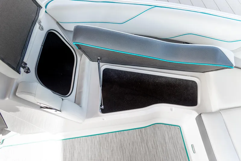 Slide: The Image of Manufacturer Provided Image: 2026 Regal LS4 boat interior storage compartments with sleek upholstery design. - 11
