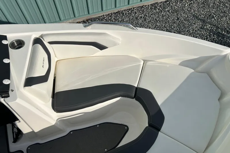 Slide: The Image of 2016 Larson LX 205S IO boat interior with white and black seating. - 26