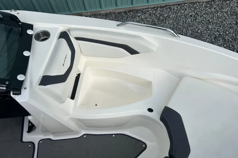 Slide: The Image of 2016 Larson LX 205S IO boat interior with seating and cup holder. - 28