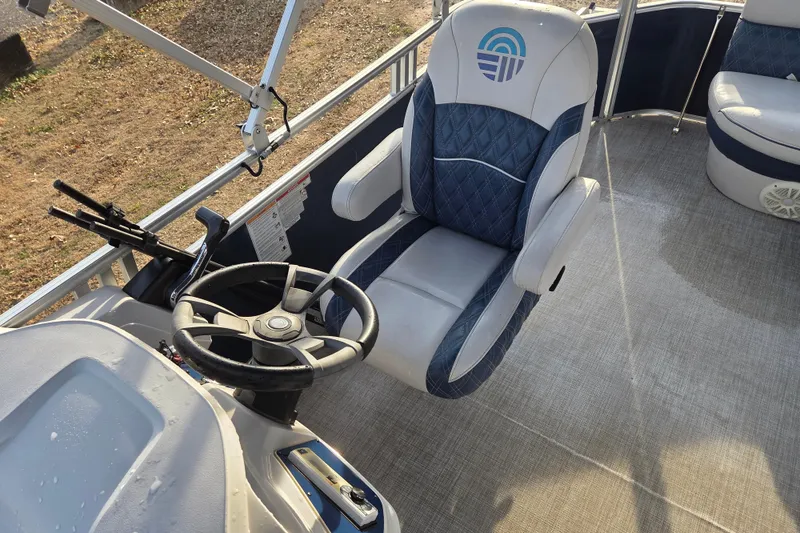 Slide: The Image of 2022 Nepallo 20TL boat interior with steering wheel and cushioned seating. - 10