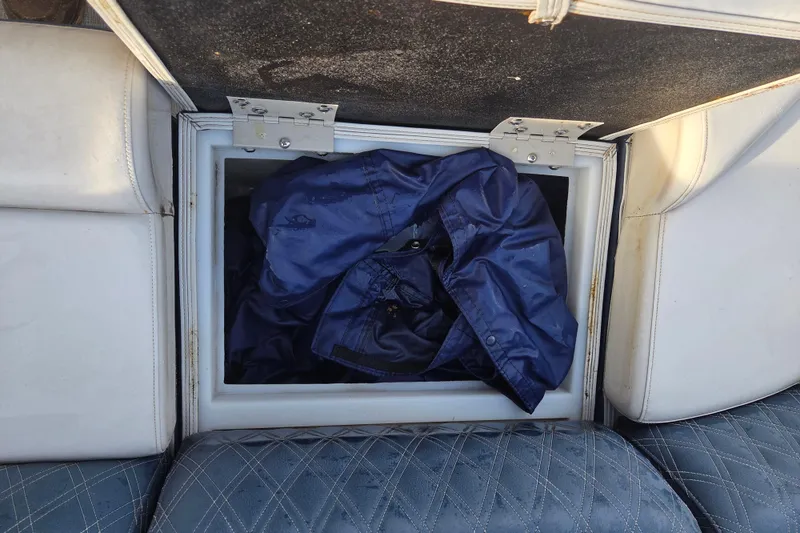 Slide: The Image of Storage compartment in a 2022 Nepallo 20TL boat with blue fabric inside. - 16