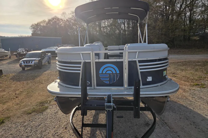 Slide: The Image of 2022 Nepallo 20TL pontoon boat on trailer, parked outdoors under a sunny sky. - 5