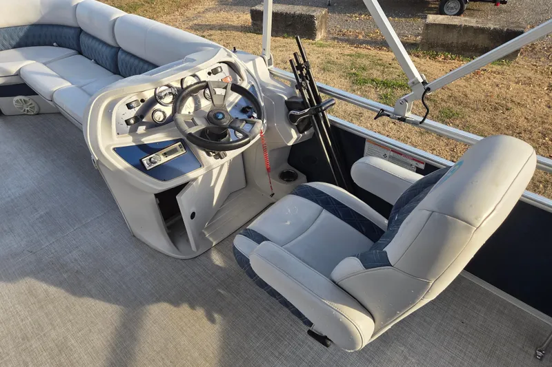 Slide: The Image of 2022 Nepallo 20TL boat interior with steering console and seating area. - 9