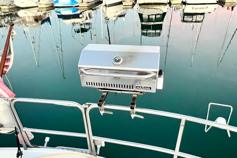 Slide: The Image of Outdoor grill on a 1990 Hunter Legend 40 sailboat, docked at a marina. - 13