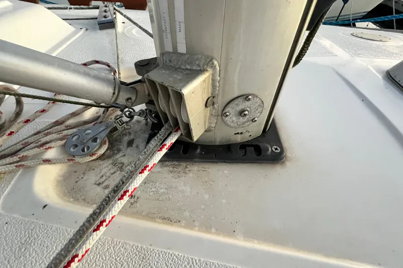 Slide: The Image of Close-up of a 1990 Hunter Legend 40 sailboat mast base with rigging and ropes. - 16