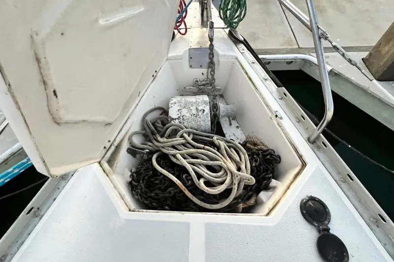 Slide: The Image of Anchor locker of 1990 Hunter Legend 40 sailboat with chain and rope. - 18