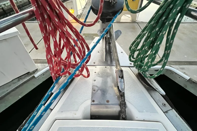 Slide: The Image of Deck view of 1990 Hunter Legend 40 sailboat with colorful ropes and anchor chain. - 19