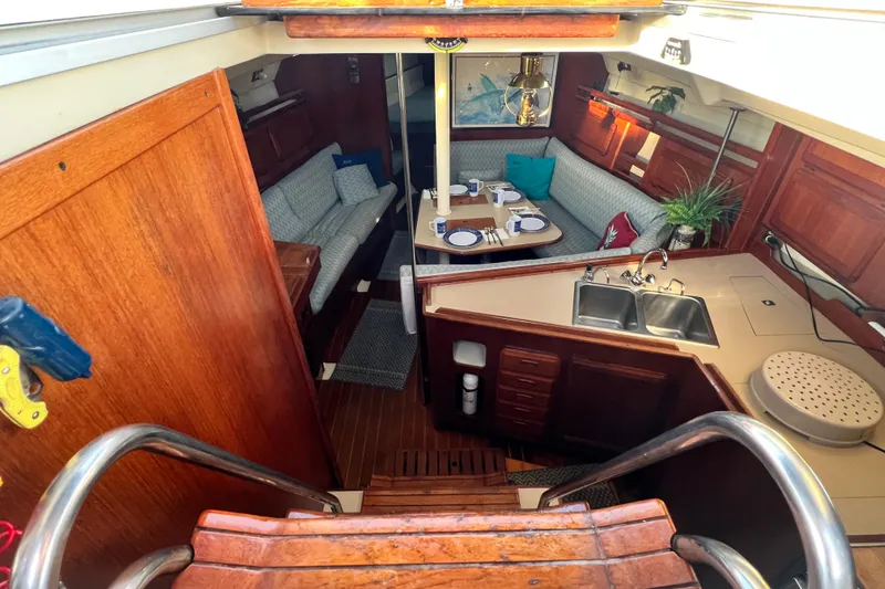 Slide: The Image of Interior of 1990 Hunter Legend 40 sailboat with cozy seating and dining area. - 26