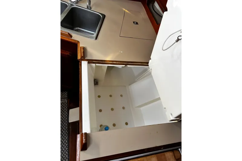 Slide: The Image of Interior view of 1990 Hunter Legend 40 yacht kitchen with sink and storage. - 30