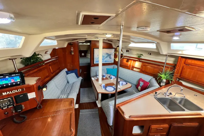 Slide: The Image of Interior of 1990 Hunter Legend 40 yacht with cozy seating and dining area. - 35