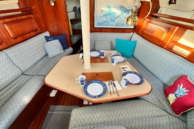 Slide: The Image of Cozy dining area in 1990 Hunter Legend 40 sailboat with elegant table setting. - 36