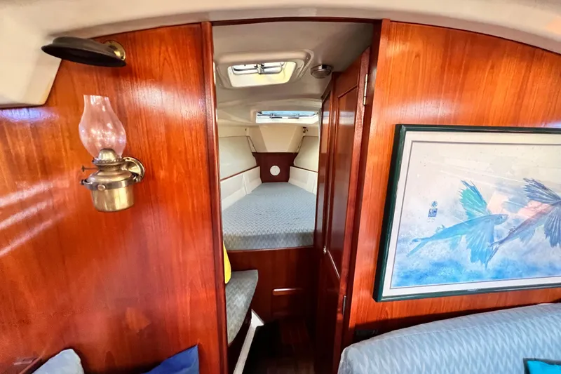 Slide: The Image of Interior of 1990 Hunter Legend 40 sailboat with wood paneling and cozy cabin. - 37