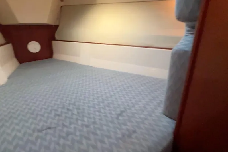 Slide: The Image of Interior cabin of 1990 Hunter Legend 40 sailboat with patterned bedding. - 39