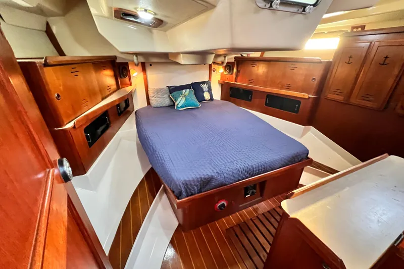 Slide: The Image of Cozy cabin interior of 1990 Hunter Legend 40 sailboat with wooden furnishings. - 47