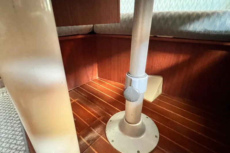 Slide: The Image of Interior of 1990 Hunter Legend 40 sailboat, featuring wooden flooring and structural support. - 52
