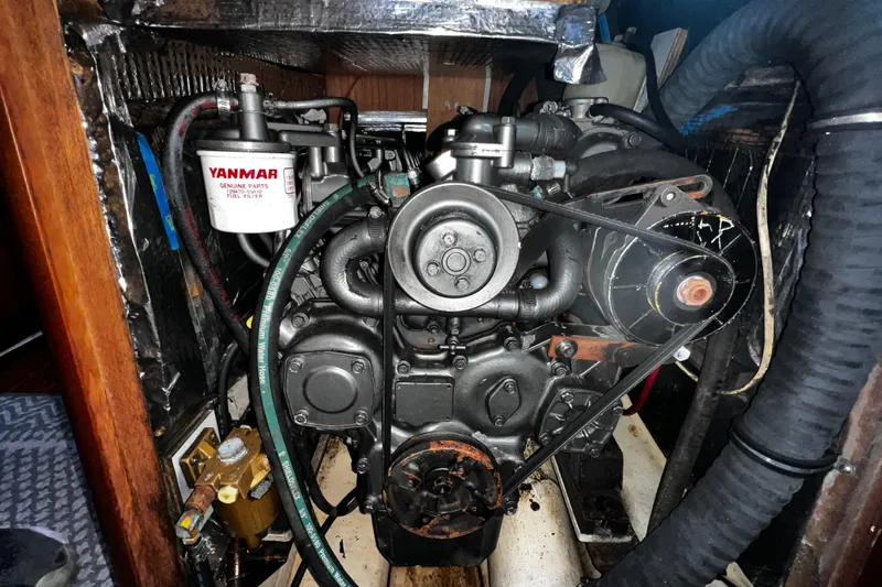 Slide: The Image of Engine compartment of a 1990 Hunter Legend 40 sailboat with Yanmar fuel filter. - 60