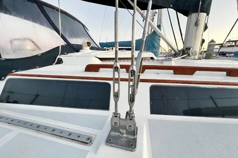 Slide: The Image of 1990 Hunter Legend 40 sailboat deck with rigging and windows. - 7