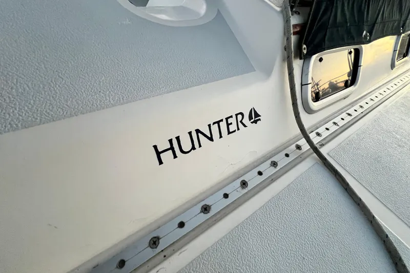 Slide: The Image of 1990 Hunter Legend 40 sailboat deck with logo and textured surface. - 9
