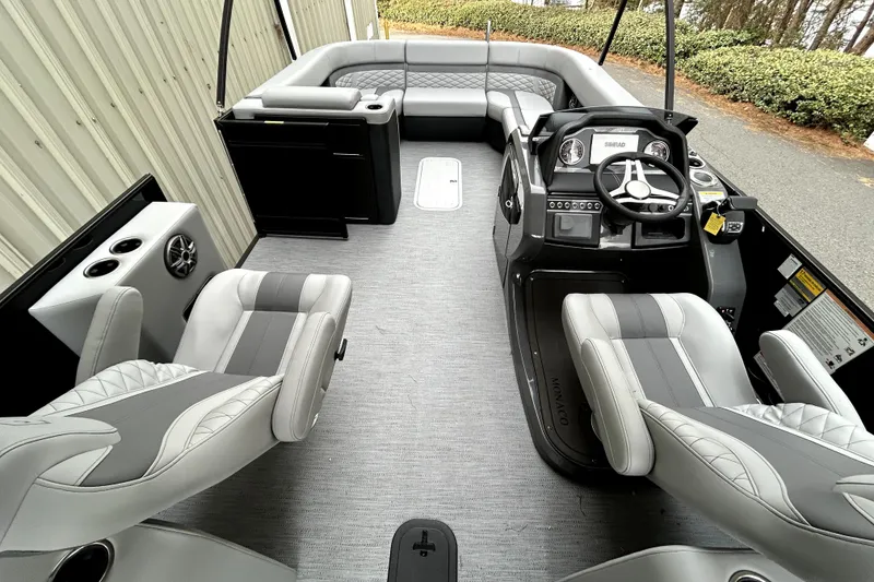 Slide: The Image of Interior of 2026 Godfrey Monaco 255 SDC boat with modern seating and steering console. - 3