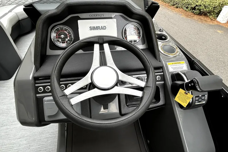 Slide: The Image of Steering console of 2026 Godfrey Monaco 255 SDC boat with Simrad display. - 8