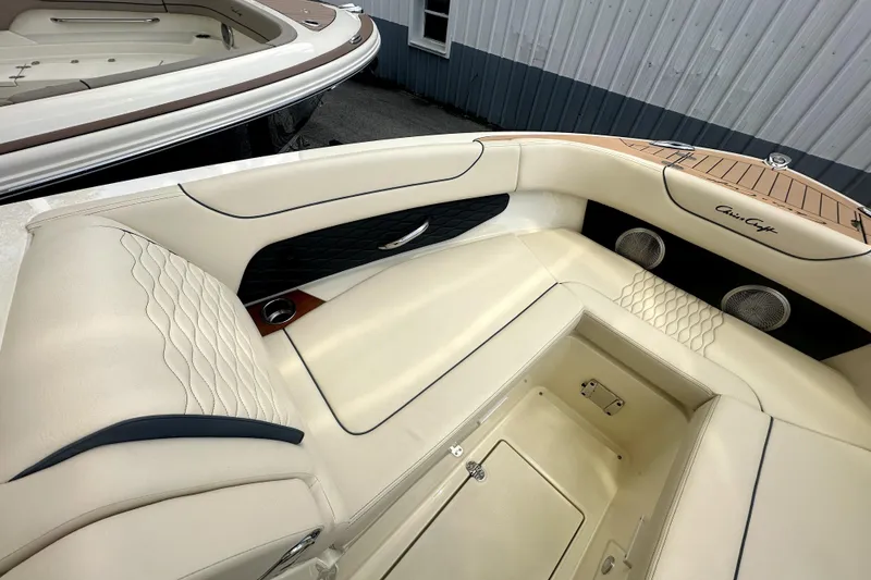 Slide: The Image of Luxurious interior of 2026 Chris-Craft Sportster 28 boat with elegant seating and speakers. - 11