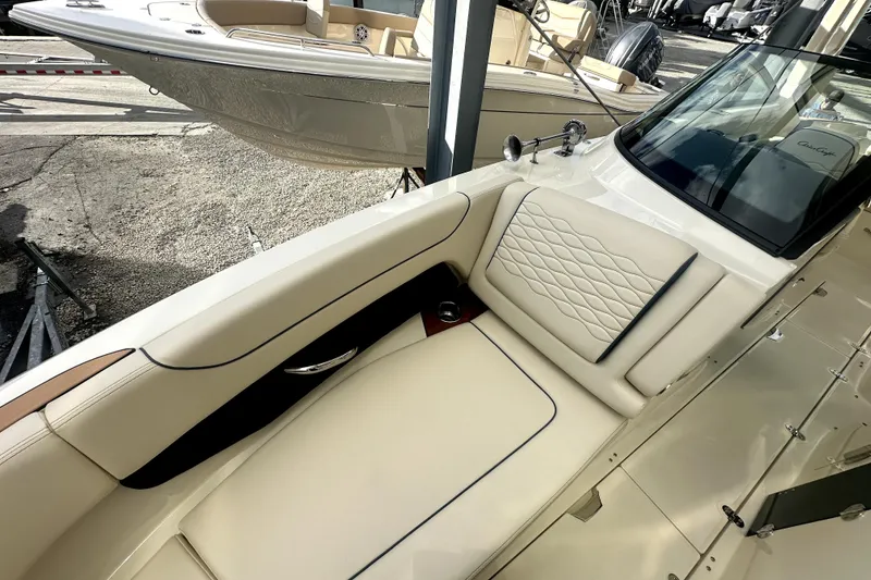 Slide: The Image of 2026 Chris-Craft Sportster 28 boat interior with luxurious cream seating and elegant design. - 13