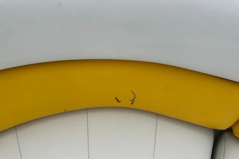Slide: The Image of Close-up of 2003 VIP Deckliner 224 boat seat with yellow and white upholstery. - 24
