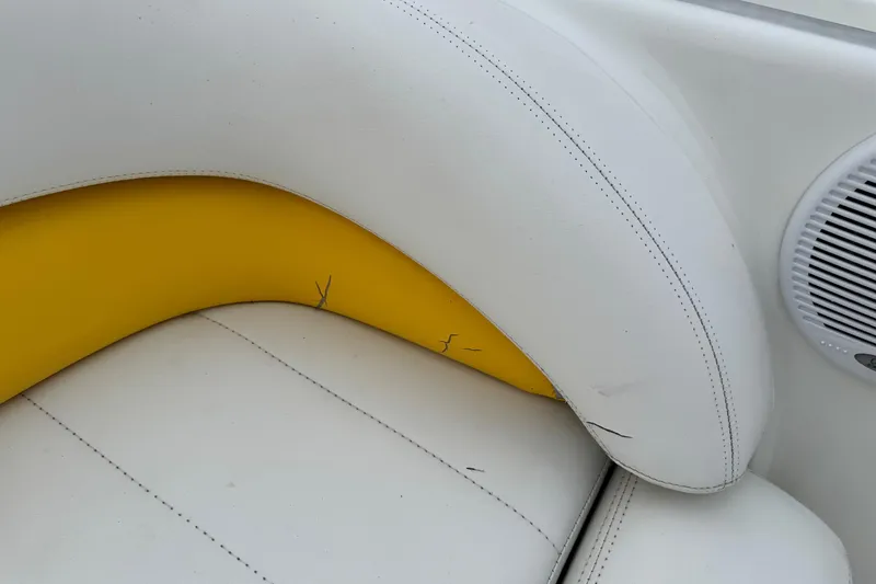 Slide: The Image of White and yellow boat seat with visible wear, VIP Deckliner 224, 2003 model. - 30