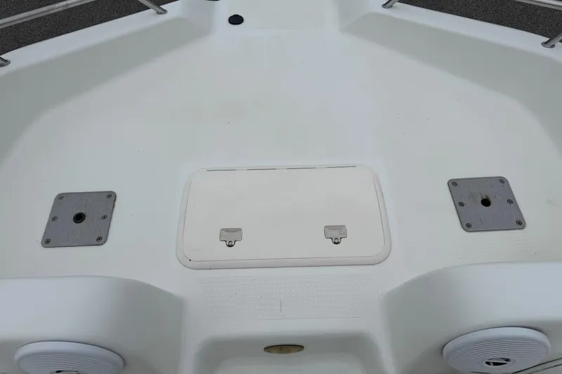 Slide: The Image of 2003 VIP Deckliner 224 boat deck with storage hatch and speaker. - 33