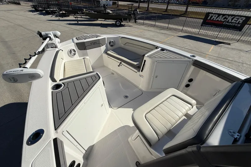 Slide: The Image of 2019 Yamaha Boats 210 FSH Sport interior with seating and storage compartments. - 12