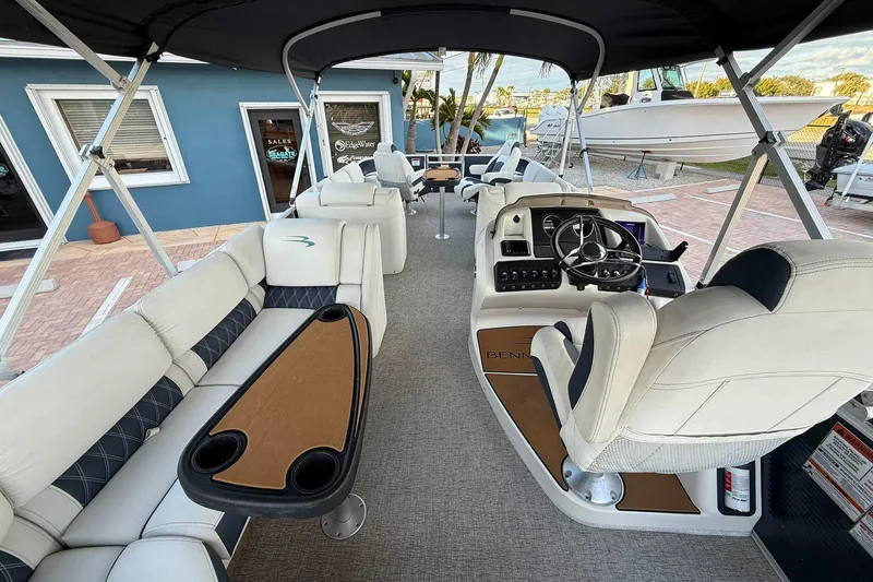 Slide: The Image of 2019 Bennington R 25 RL pontoon boat interior with seating and helm station. - 12