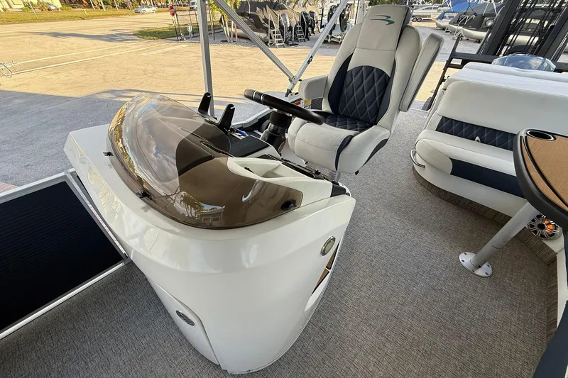 Slide: The Image of 2019 Bennington R 25 RL boat interior with helm and seating area. - 15