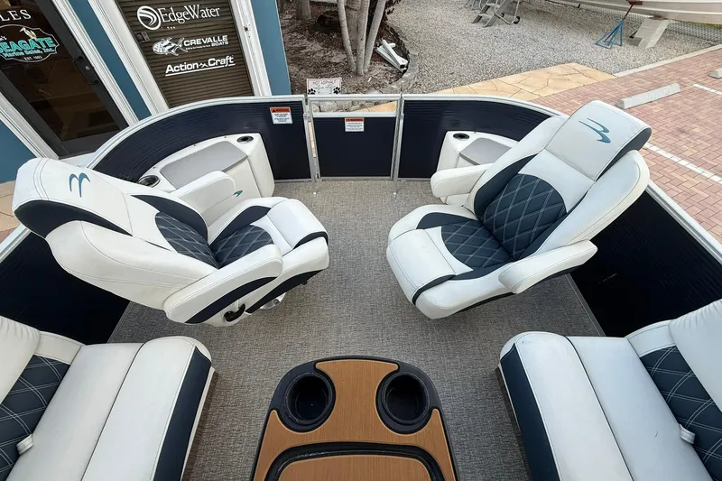 Slide: The Image of 2019 Bennington R 25 RL boat interior with luxurious seating and cup holders. - 22