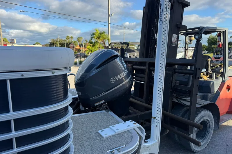 Slide: The Image of 2019 Bennington R 25 RL boat with Yamaha outboard engine on forklift. - 6