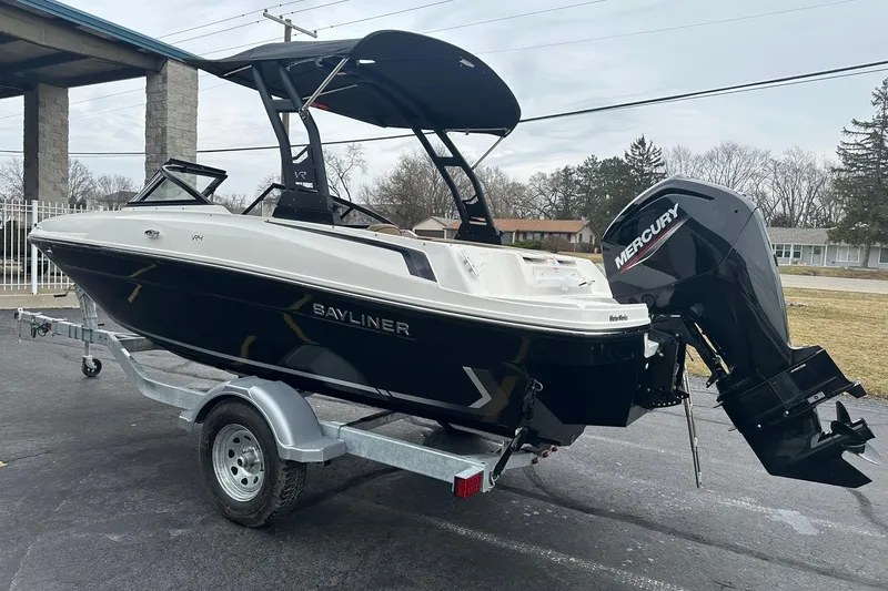 Slide: The Image of 2026 Bayliner VR4 Bowrider OB with Mercury outboard engine on trailer. - 4