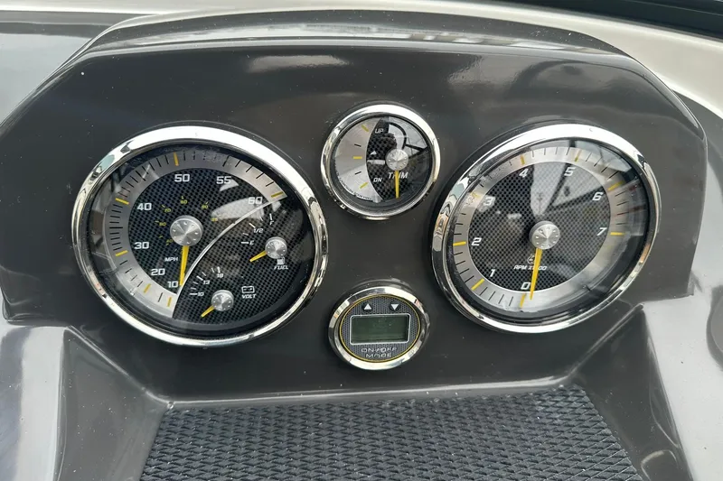 Slide: The Image of Dashboard of 2026 Bayliner VR4 Bowrider OB with speedometer and tachometer gauges. - 9