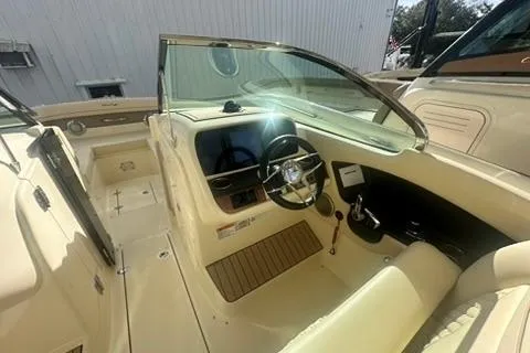 Slide: The Image of 2026 Chris-Craft Calypso 28 boat interior with seating and Mercury engines. - 10