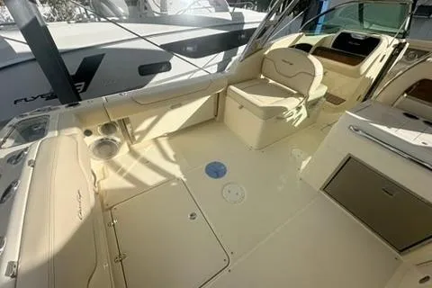 Slide: The Image of 2026 Chris-Craft Calypso 28 boat in a sunlit marina setting. - 6