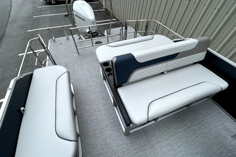 Slide: The Image of 2026 Godfrey Sweetwater 2286 SFLC pontoon boat with spacious seating and Honda outboard motor. - 12